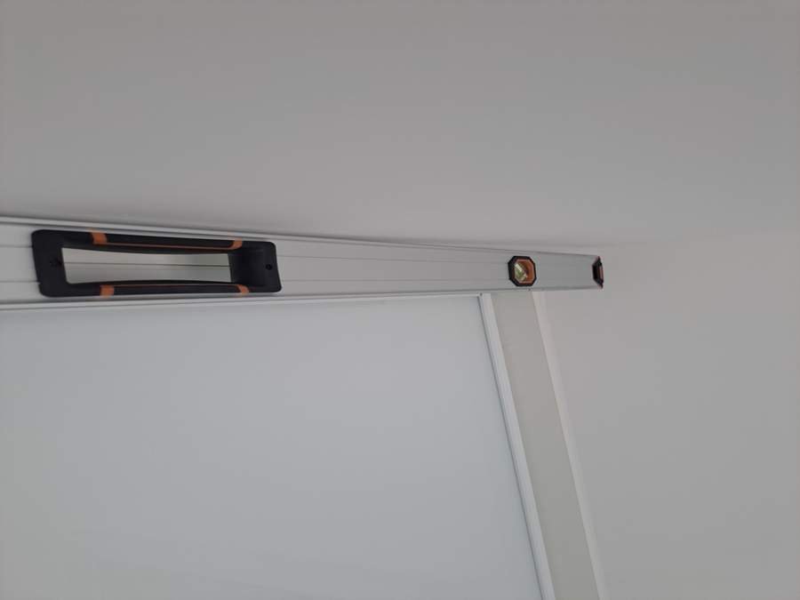 Services 2 Ready 2 Inspect Checking Door Level As Part Of Snagging Survey Inspection.