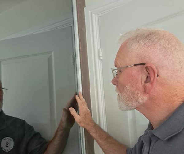 Rob from Ready 2 Inspect inspecting a property as part of a snagging survey inspection Rob from Ready 2 Inspect inspecting a property as part of a snagging survey inspection