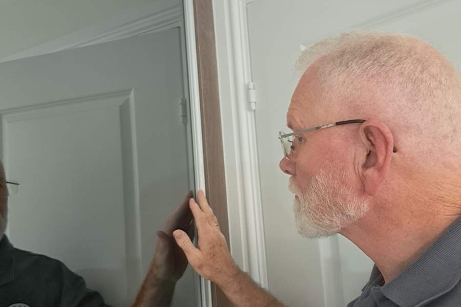 Rob from Ready 2 Inspect inspecting a property as part of a snagging survey inspection